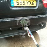BMW X5 E53 3.0i being filled up with autogas at the gas station