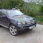 BMW X5 E53 4.4is v8 being filled up at autogas stations